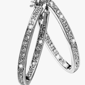 Sterling silver and CZ inner rimmed hoop earrings.